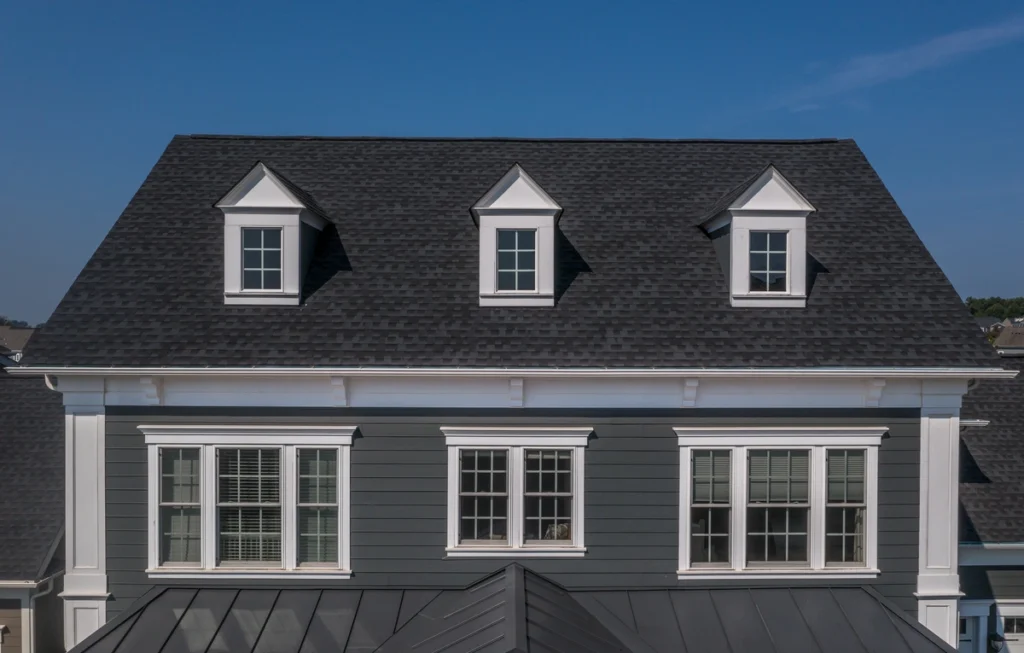 house roof with black shingles and dormers
