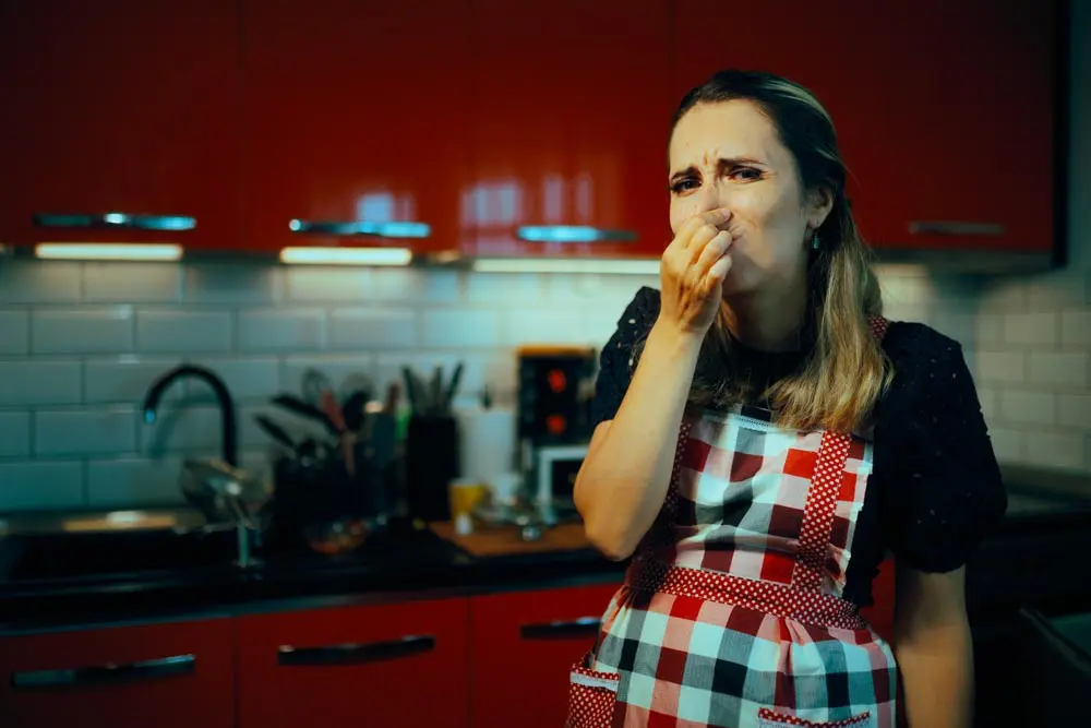 homeowner pinching their nose
