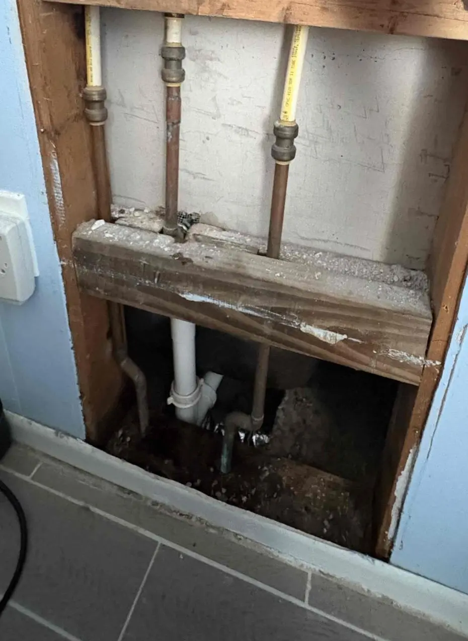 New copper supply lines and stub-outs inside an opened wall during a whole-home repipe