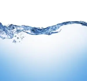 Flowing water with bubbles, symbolizing water usage and conservation in plumbing, relevant to identifying leaks and reducing water bills.