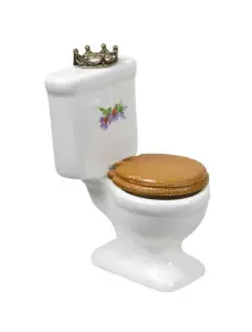 Decorative toilet with a crown, featuring a brown wooden seat and floral design, symbolizing the evolution of toilet design from historical royal use.