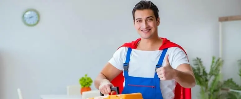 Young man in superhero costume with a toolbox, promoting Allore's Plumbing Services readiness and positivity.