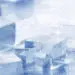Ice cubes in a glass of water, symbolizing the refreshing quality of treated water, relevant to discussions on water softeners and improving water quality.