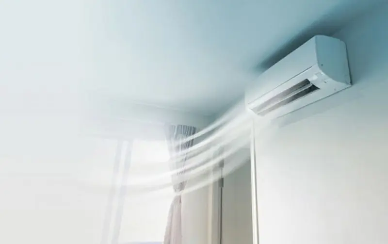 Ductless air conditioning unit in a bright room with cool air flow, representing Superior Plumbing, Heating & Air-Conditioning's HVAC services.