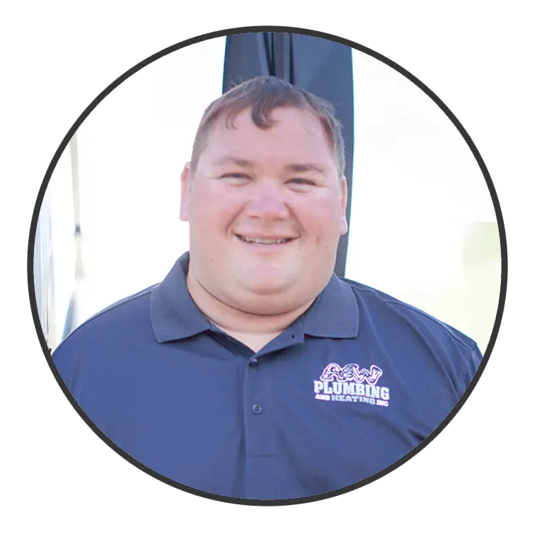 Smiling male plumber wearing a navy shirt with "A&W Plumbing and Heating, Inc." logo, representing the service expert team at A&W Plumbing and Heating in Southern Illinois.