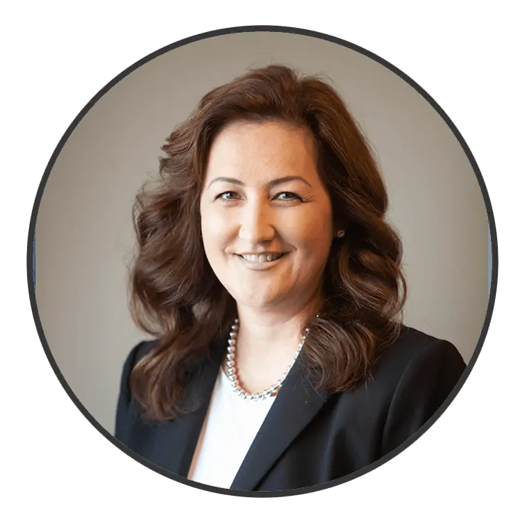 Professional portrait of a woman with wavy hair, wearing a black blazer and pearl necklace, representing the A & W Plumbing and Heating, Inc. team.