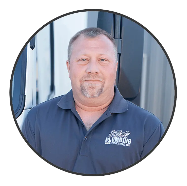 Plumber and foreman from A & W Plumbing and Heating, Inc. posing in a branded polo shirt, showcasing commitment to quality service in Southern Illinois.