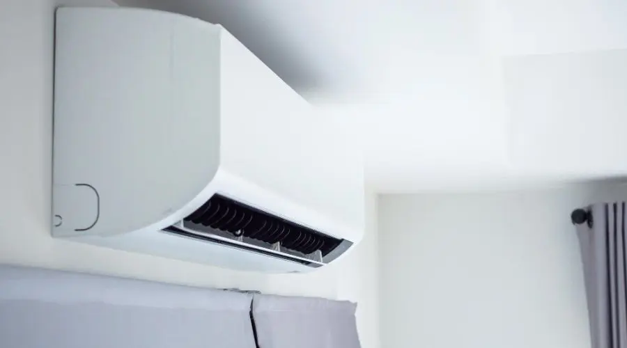 Air conditioning unit mounted on wall with minimalist design in a modern space from B & D Plumbing, Heating & A/C.
