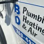 B & D Plumbing Heating & A/C service vehicle with logo and contact information for Minnetonka plumbing services.