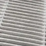 Air filter with a layered, patterned structure in light gray, emphasizing air quality and cleanliness for HVAC systems.