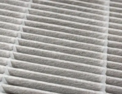 Air conditioning filter showing clean, pleated design, emphasizing importance of HVAC maintenance for optimal performance.