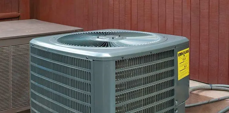Air conditioning unit in a residential setting, highlighting repair and maintenance services offered by Boutwell's Air Masters in Pensacola, FL.