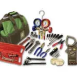 Toolbag with tools, including pliers and pressure gauges, emphasizing professional HVAC repair readiness.