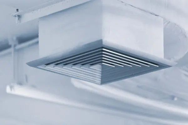 HVAC air vent installed in a ceiling, illustrating air distribution in home heating and cooling systems.