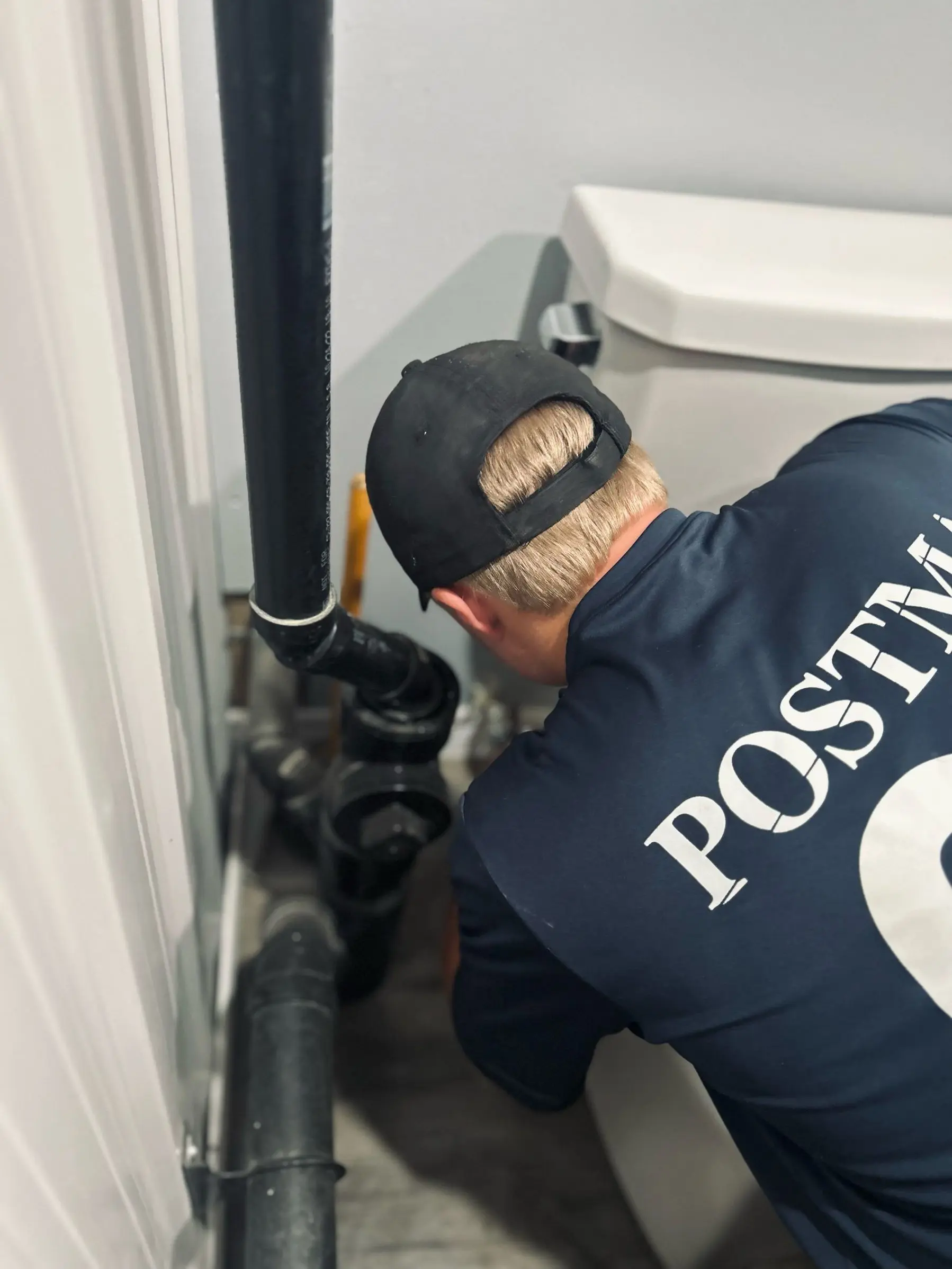 Chatham plumbing technician working on a bathroom plumbing installation.