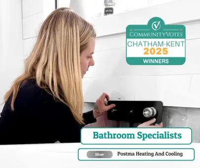 Postma technician installing a bathroom fixture, winner of Chatham-Kent 2025 Bathroom Specialists Silver Award
