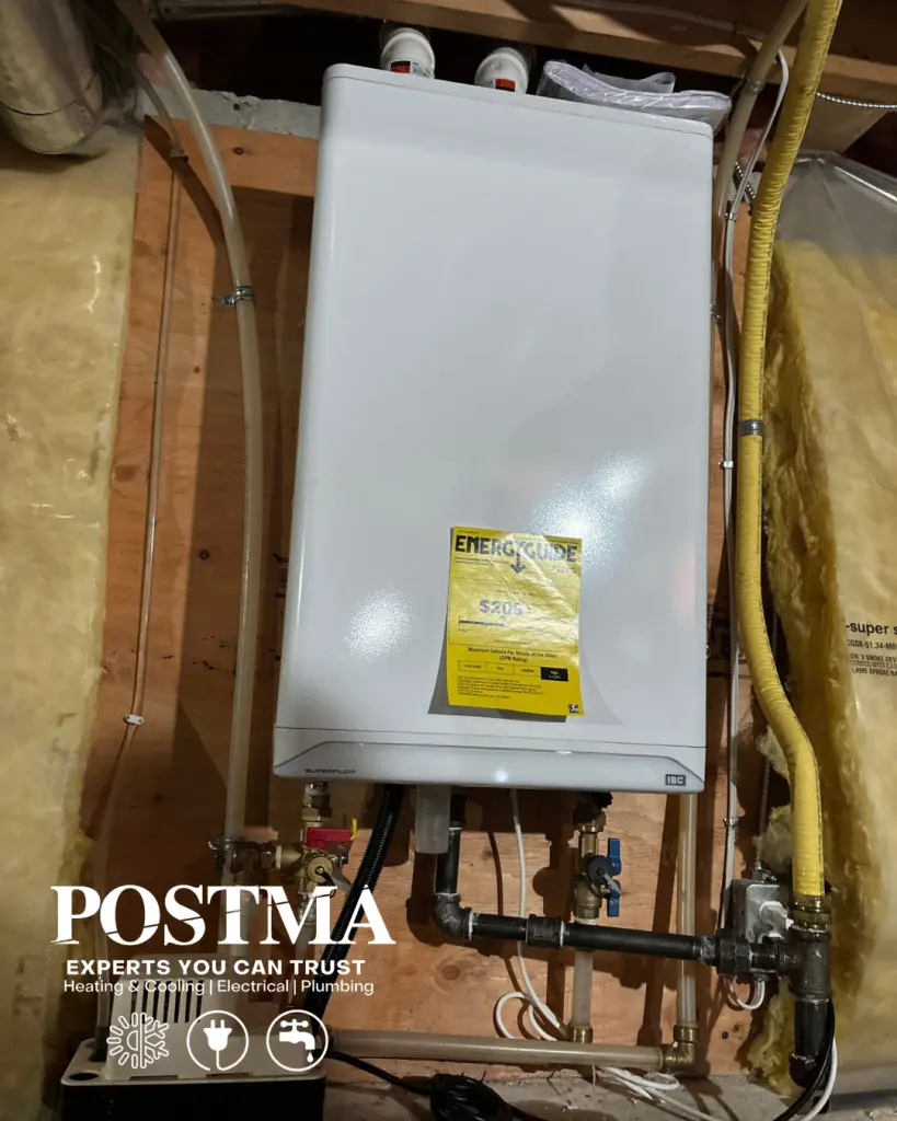 Tankless hot water heater versus traditional tank system installed by Postma.