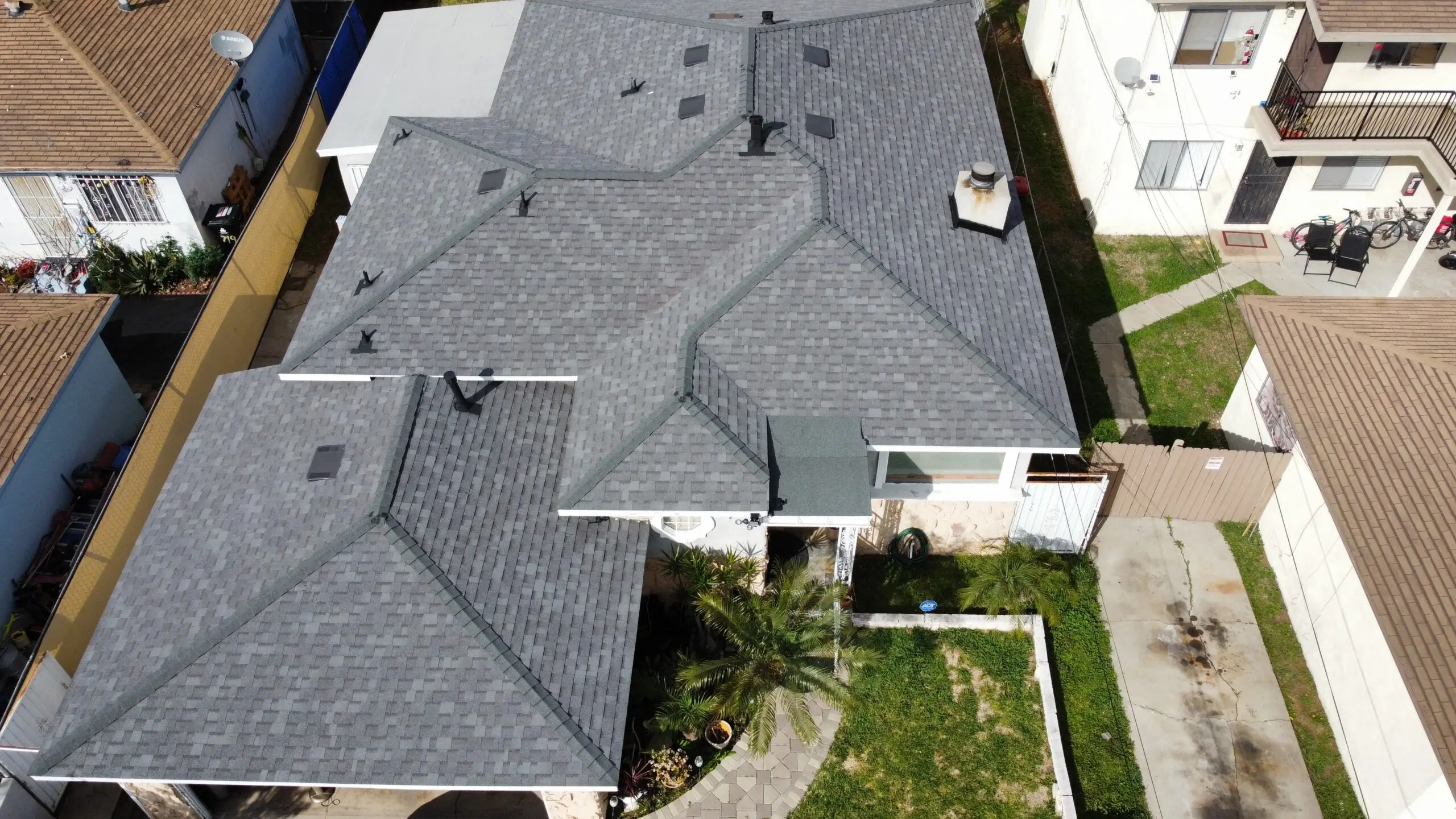 A dark grey shingle roof