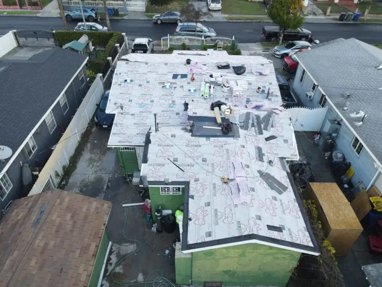 roofing lakewood ca workers replacing big roof white paper