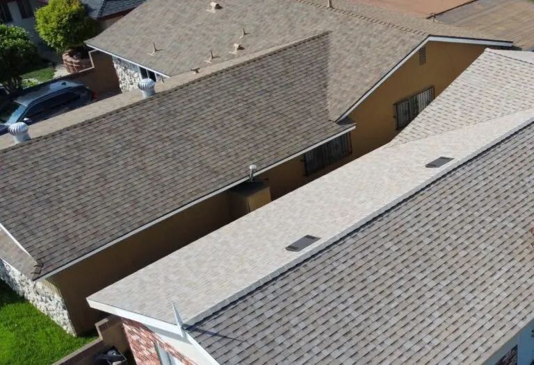 Two roofs with different shades of shingles