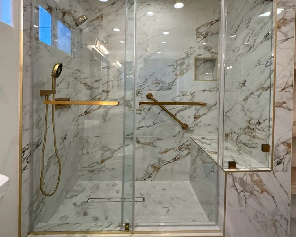 Marble shower with a marble floor