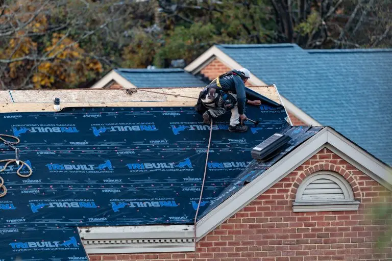 guy replacing roof underlayment