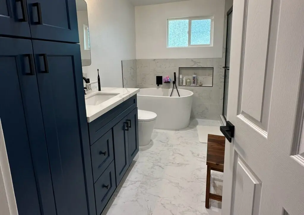 White marble floor in a bathroom with a bath tub