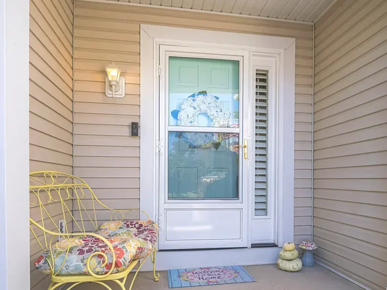 front door hardware white door light yellow siding