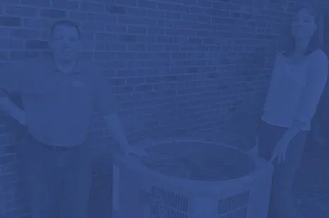 Technician and customer standing beside an air conditioning unit, showcasing HVAC service expertise and customer satisfaction for Air Works Heating & Air.