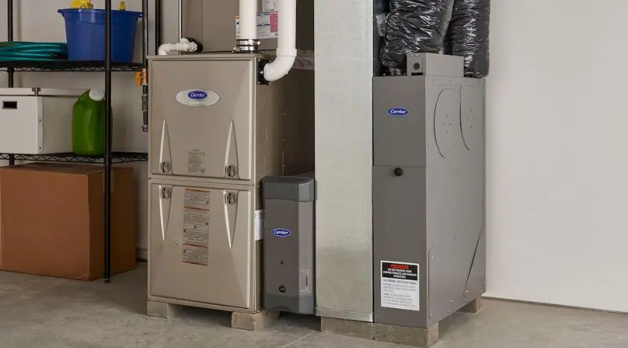 New heating system installation featuring a Carrier furnace, showcasing efficient HVAC solutions for winter comfort and home maintenance.