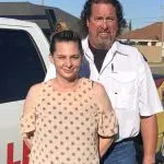Man and woman collaborating near a work truck, showcasing The Darville Company's plumbing and HVAC services.