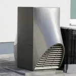 Sleek air conditioning unit showcasing modern HVAC design with smooth metallic curves, emphasizing energy efficiency.