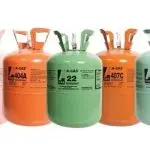 Gas cylinders for refrigerants like 404A and 22, featuring labels and logos, displayed by Chad's AC Direct.