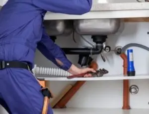 someone drain cleaning