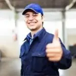 HVAC technician in uniform giving a thumbs-up, representing reliable service and customer satisfaction from Chris Wilson Plumbing & Heating Repairs Inc.