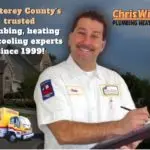 Chris Wilson Plumbing & Heating Repairs Inc. technician smiling and holding a clipboard, showcasing expertise in plumbing, heating, and cooling services since 1999.