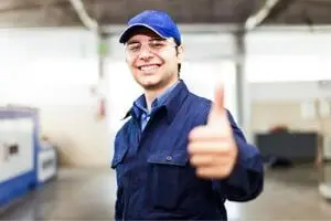 HVAC technician in uniform giving a thumbs up, representing reliable service and customer satisfaction at Chris Wilson Plumbing & Heating Repairs Inc.