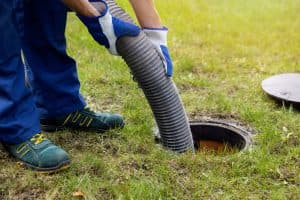 A septic tank being drained by a professional.