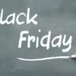 Blackboard with 'Black Friday' chalk text, promoting home services by The Meridian Company in Lansing.