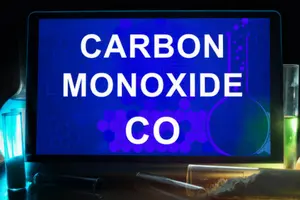 Tablet displaying "CARBON MONOXIDE CO" with laboratory glassware, emphasizing safety in HVAC and heating services.