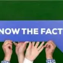 Hands holding a sign that reads "Know the Facts," emphasizing informative content about boiler systems and their advantages.