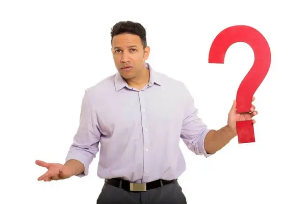 Man holding a large red question mark, expressing confusion or inquiry about heating services and HVAC solutions.