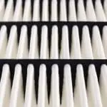 Rows of air filter elements with triangular shapes for clean and efficient HVAC air quality improvement.