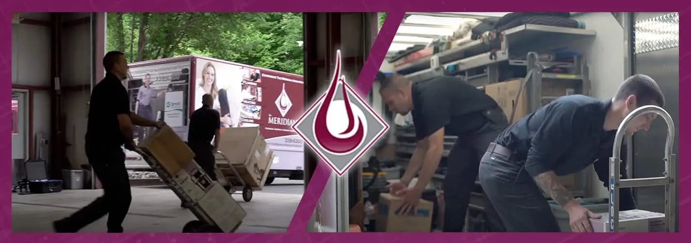 Technicians from The Meridian Company unloading equipment and supplies in a service van, showcasing teamwork and commitment to home services.