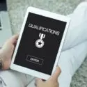 Person holding a tablet with "QUALIFICATIONS" and a medal symbol, showcasing plumbing credentials by City Plumbing.