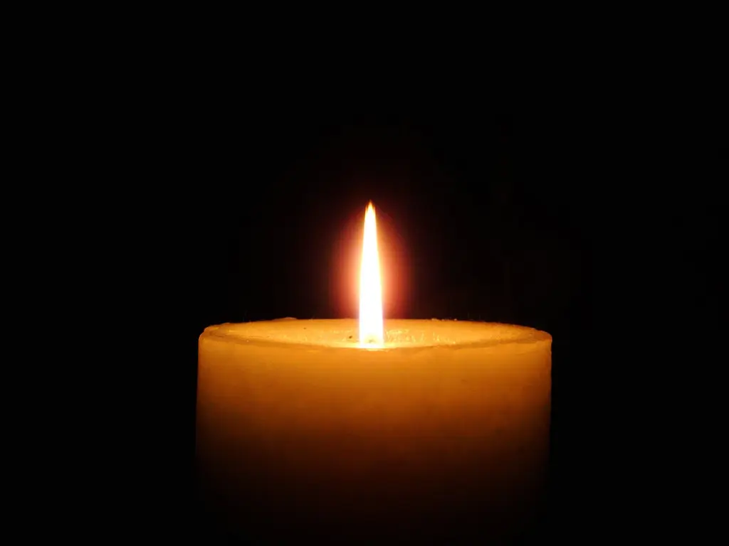 Candle Lit in a Dark Room