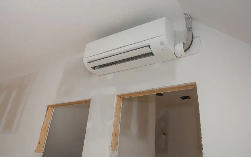 Ductless HVAC unit installed on a wall in a home, highlighting energy-efficient heating and cooling options for specific zones.