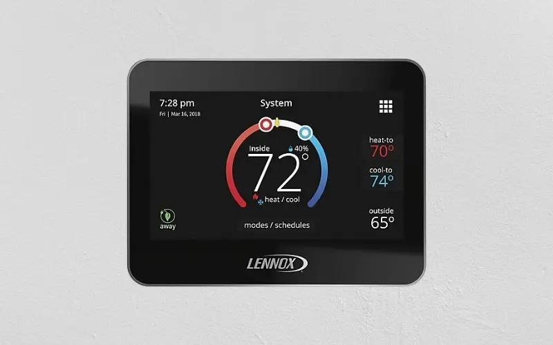 Smart thermostat displaying indoor temperature of 72&deg;F and humidity level of 40%, emphasizing energy efficiency tips for winter heating.
