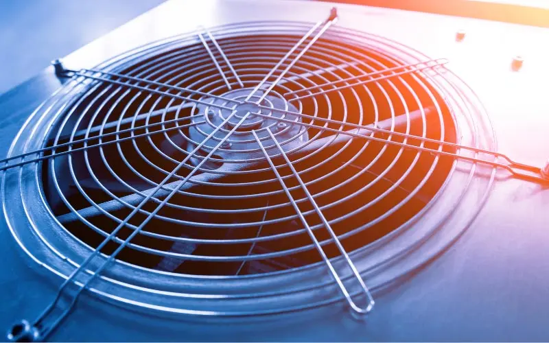 HVAC unit fan with protective grille, emphasizing air circulation for home heating and cooling solutions.