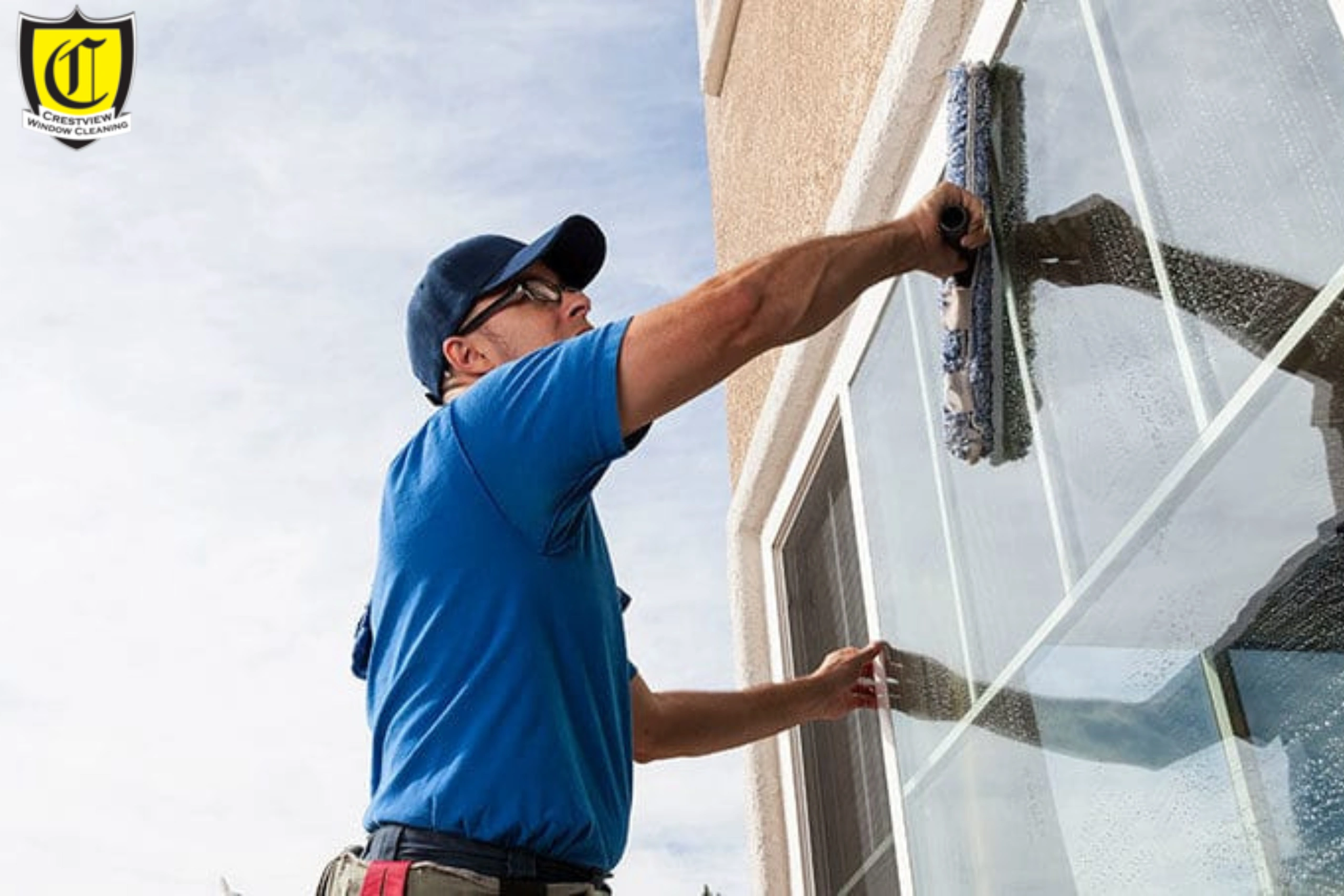 Technician performing hard water stain removal on Portland home windows